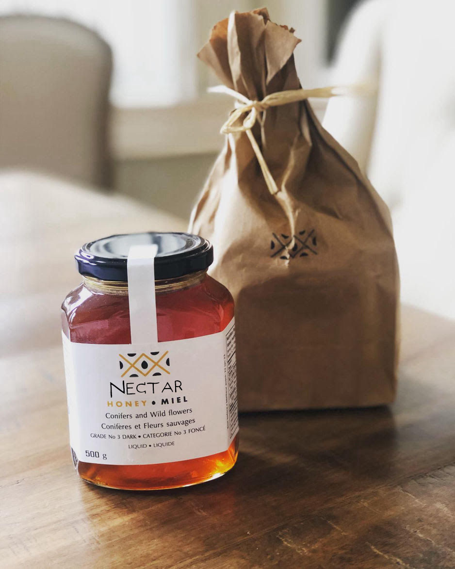 A jar of pure Greek Wildflower Honey on a table